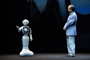 Pepper and Masayoshi Son, Chairman and Chief executive officer of SoftBank Corp talk during the news conference in Chiba, Japan. (Koki Nagahama/Getty Images)